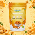 NutriVista Cheesy Cheddar Makhana pouch on a golden cheese-inspired background.